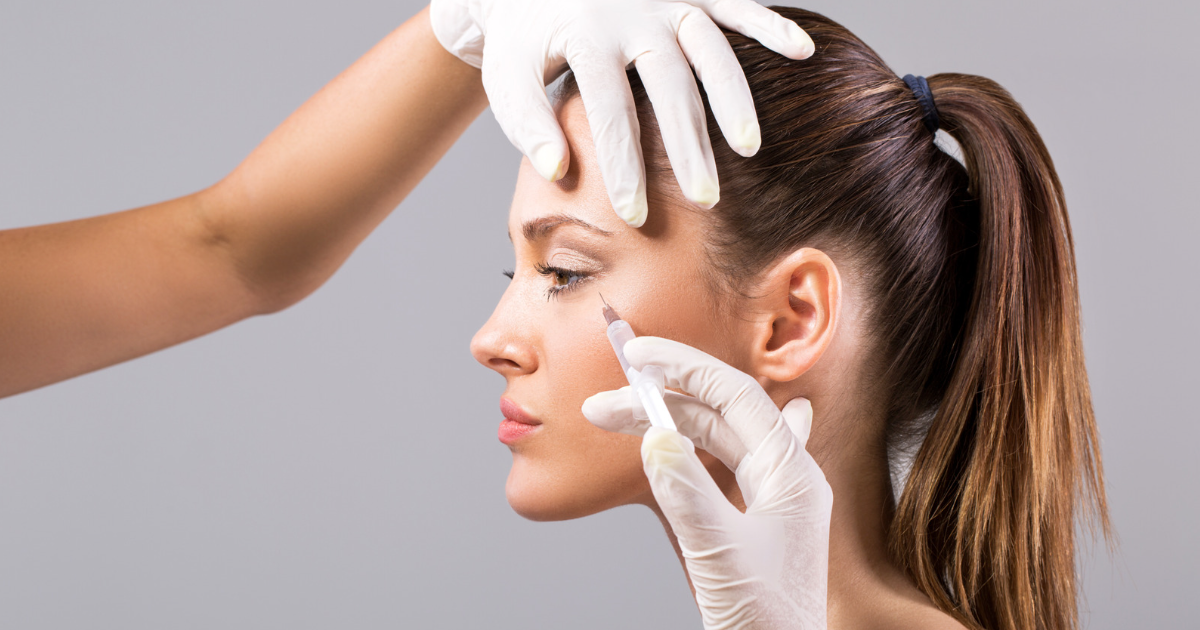 Side profile of woman being administered botox