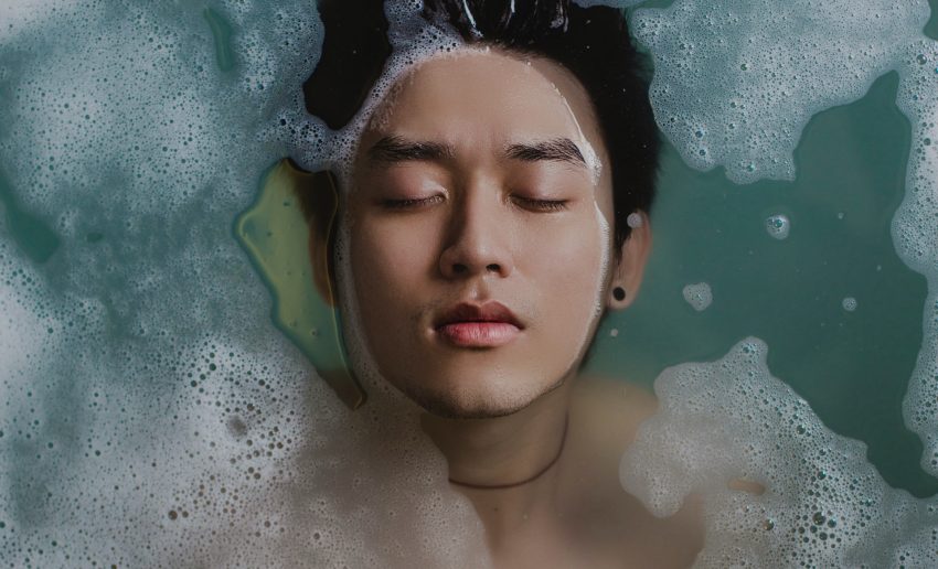 Closeup of person resting in bath water