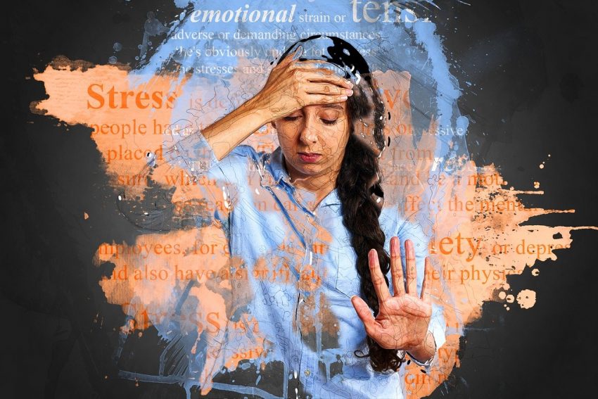 artistic representation of stress, person surrounded by stress words and triggers, hand on head, palm out, eyes closed