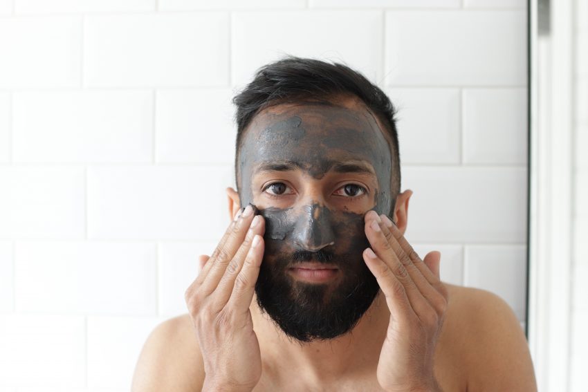 man applying face mask